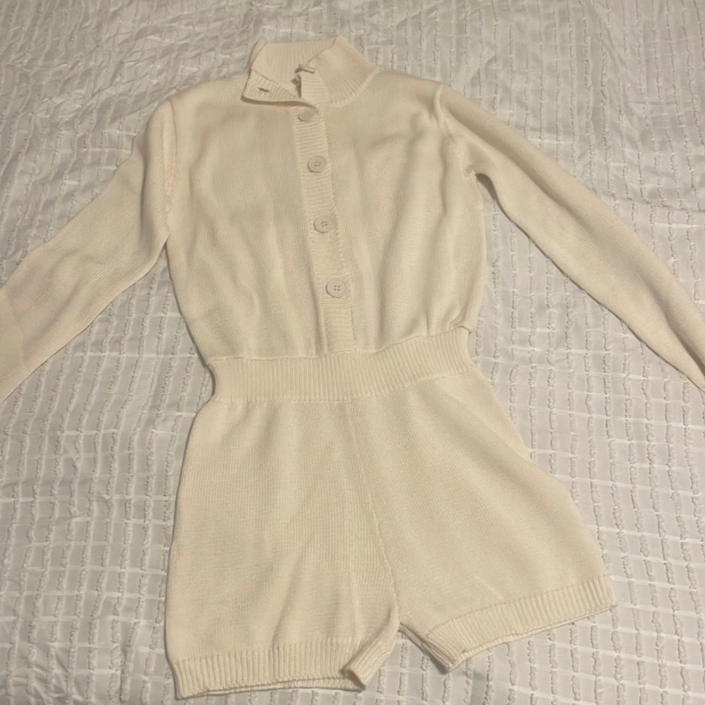 Long sleeved knitted romper.